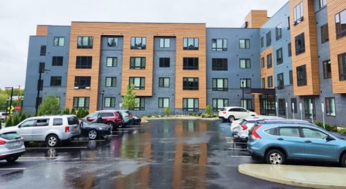 Housing estate with roof metal panel